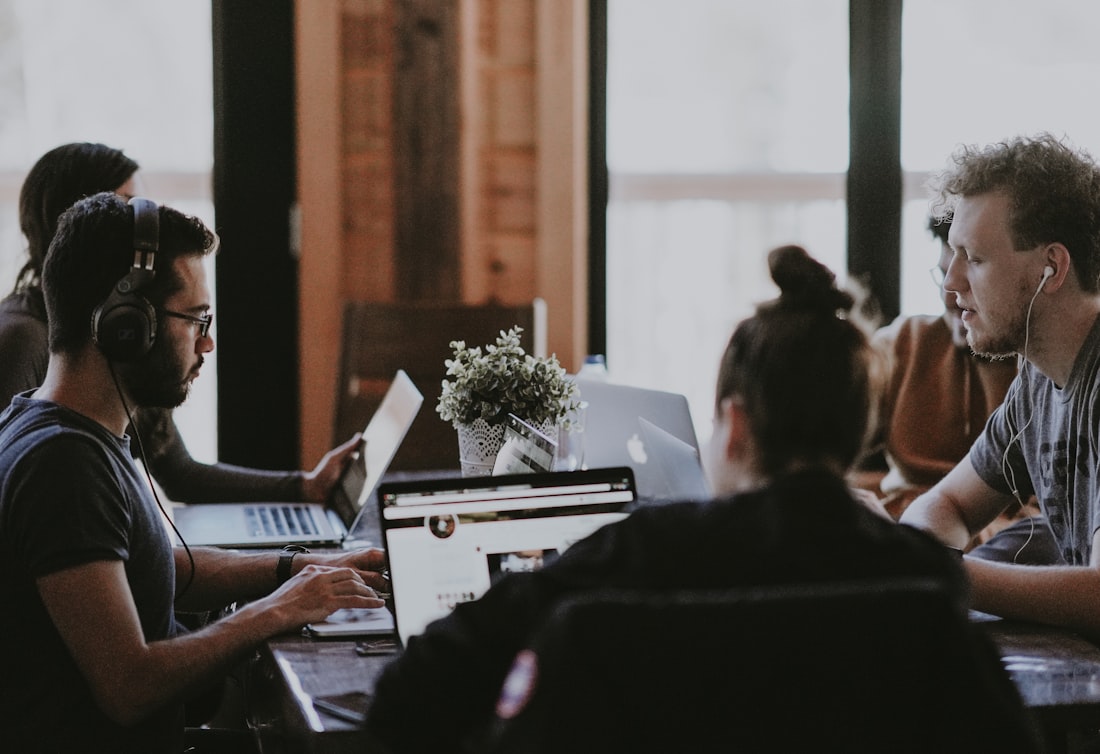 Technology team in a business meeting discussing a project