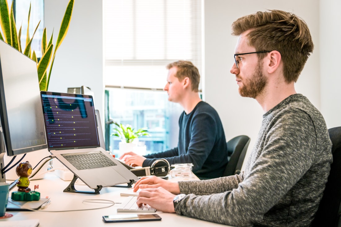 Developer writing code on a laptop